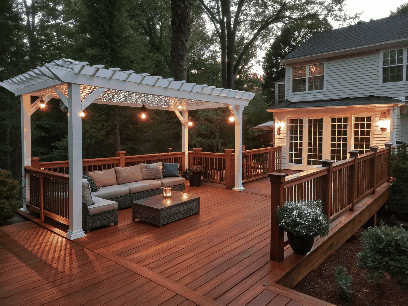 Covered cedar back porch with stone masonry outdoor fireplace, comfortable lounge seating, and wood ceiling
