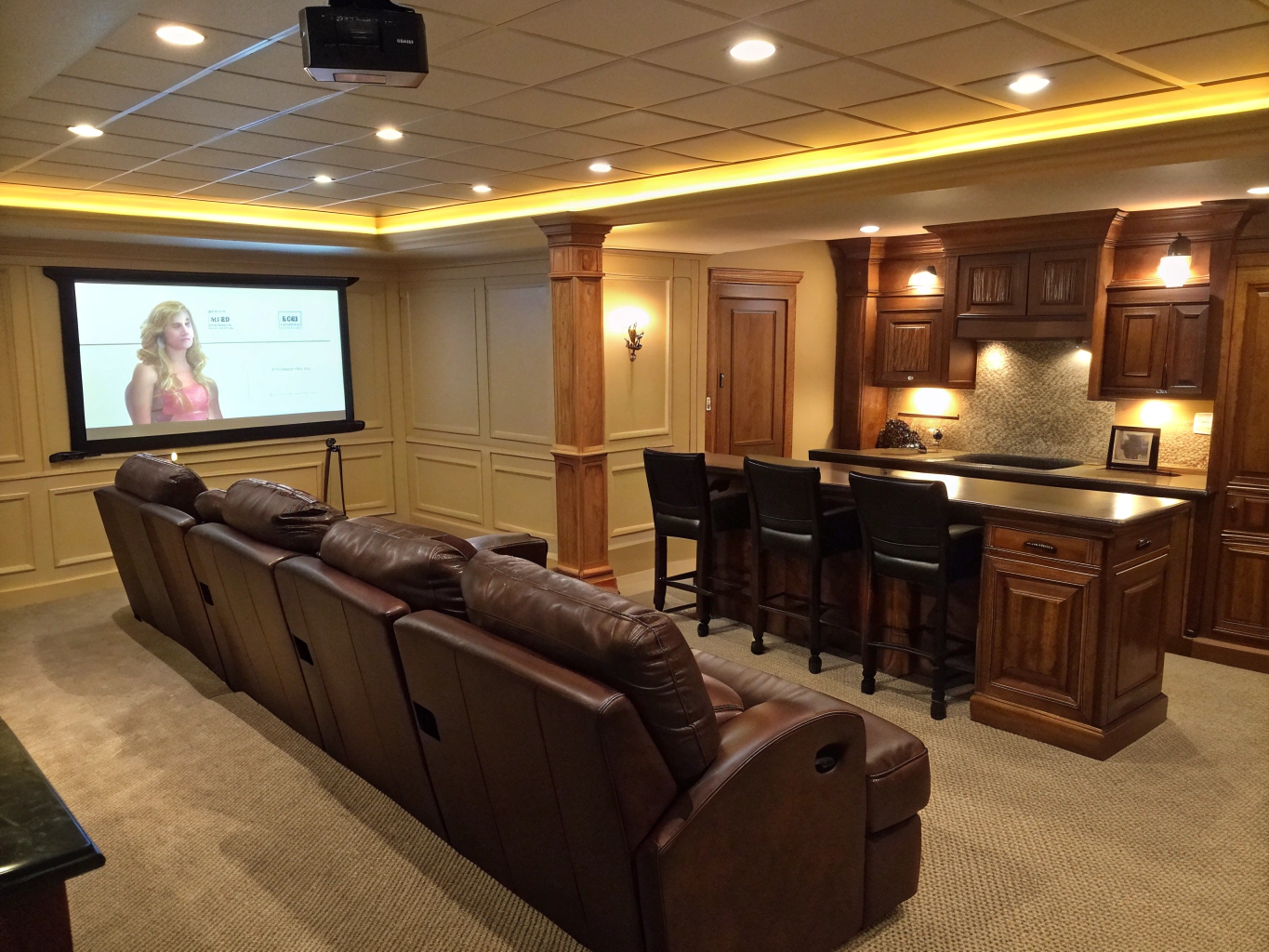 Finished walkout terrace level entertaining lounge with custom wet bar, soapstone counters, and luxury plank flooring in Smyrna